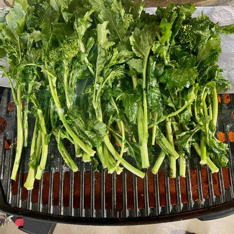 Image of Lay the seasoned broccoli rabe in a single layer, flipping as needed, to grill the stems halfway.